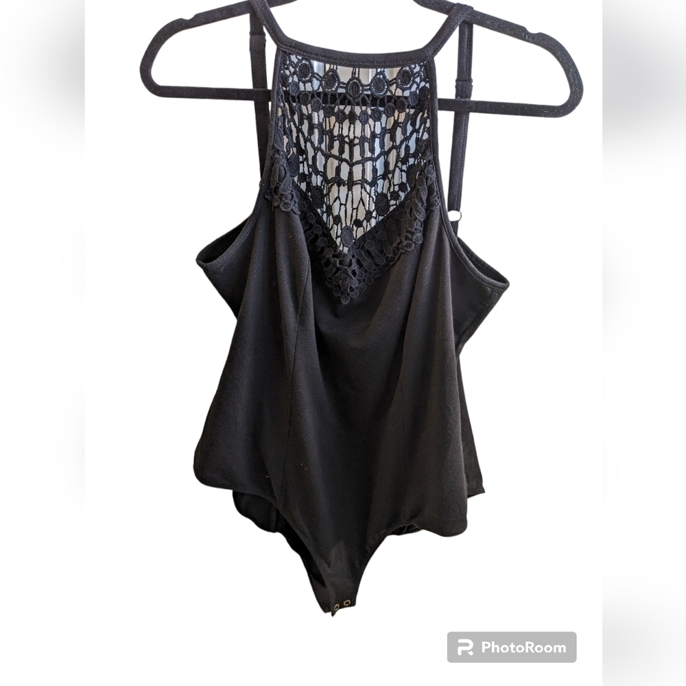 Torrid plus size body suit, black size 1.  Lace in front of bodice .  Snaps